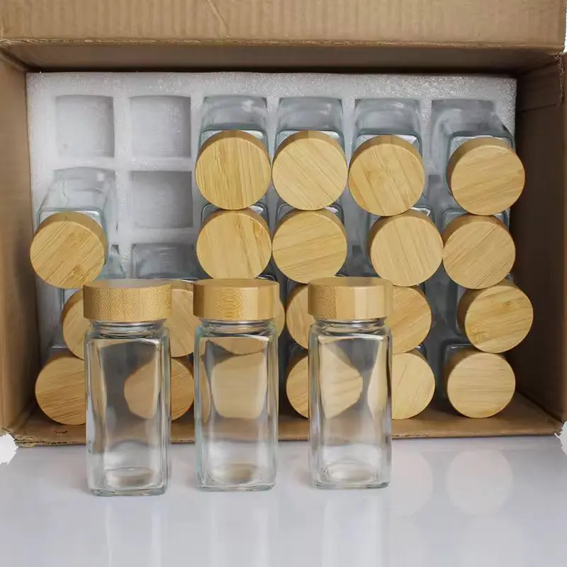 طقم توابل زجاجي كامل 24 قطعة بأغطية خشبية محكمة وجميع الملحقات